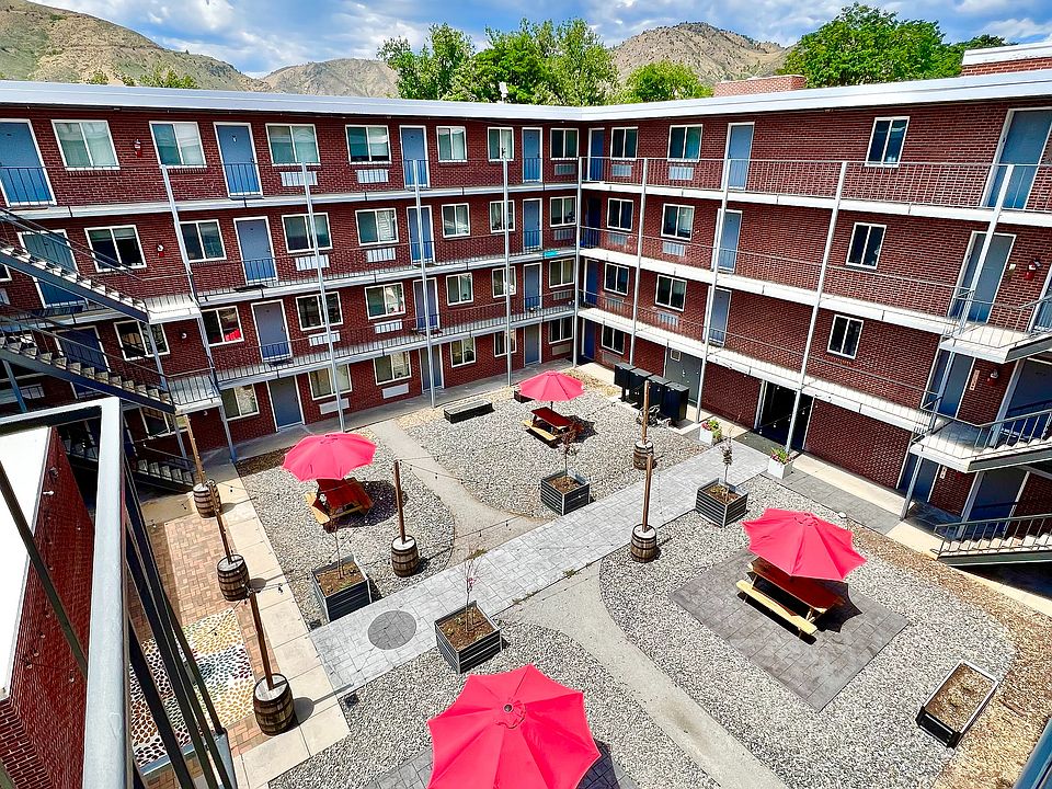 Experience the perfect outdoor retreat in this lively apartment courtyard.