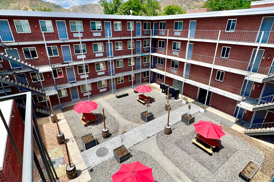 Experience the perfect outdoor retreat in this lively apartment courtyard.