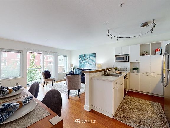 Terrific open floor plan with inviting bamboo flooring under foot.