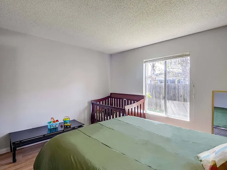 Bright bedroom filled with natural light for a warm, inviting atmosphere.