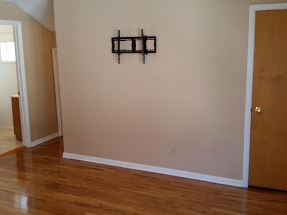 Living Room with tv wall mount and storage closet