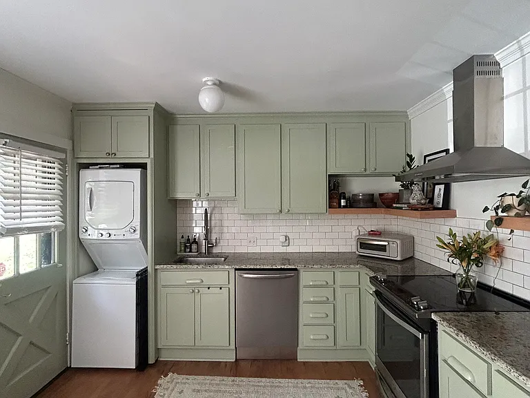 updated kitchen with granite countertops & modern appliances