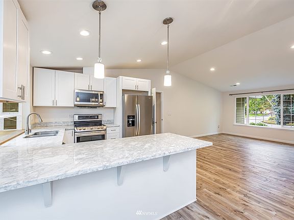 Vaulted ceiling over living and kitchen area.