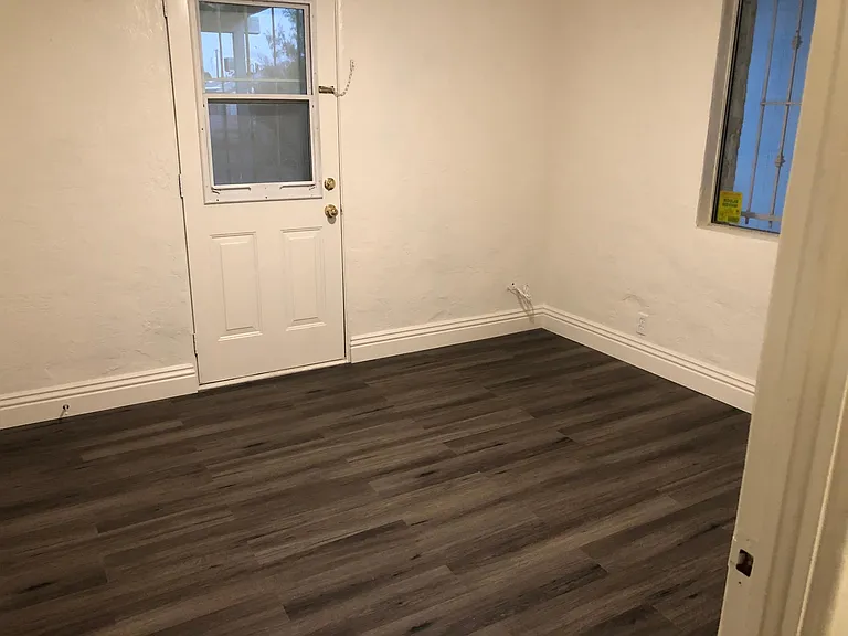 Bedroom 2 with direct access to the backyard.