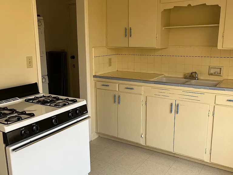 Kitchen showing door to laundry.