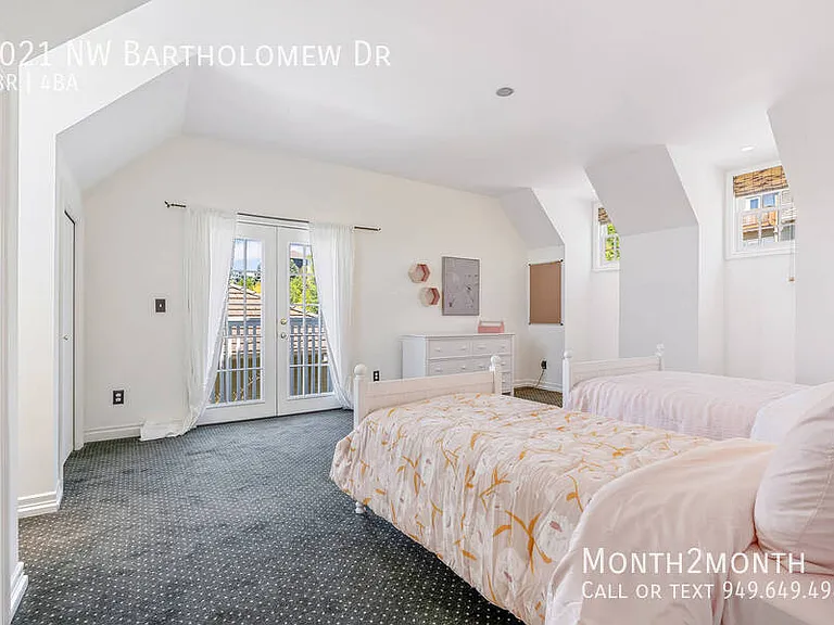9021 NW Bartholomew Dr — Photo 26