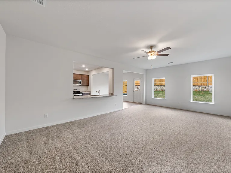 The open layout connects the family room with the kitchen and dining room.