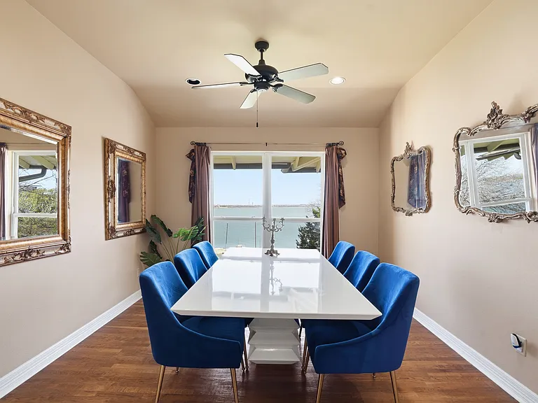 Dining room previously used as master office with doc and lake views.
