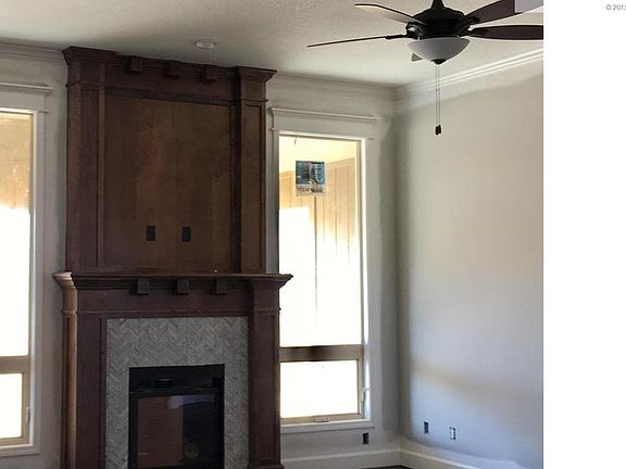 1/8/18: painting and trim work has begun! This home is nearing completion. The Great Room fireplace is beautiful and surrounded by windows. The lower  portion of these windows open, as well, which is a nice feature.