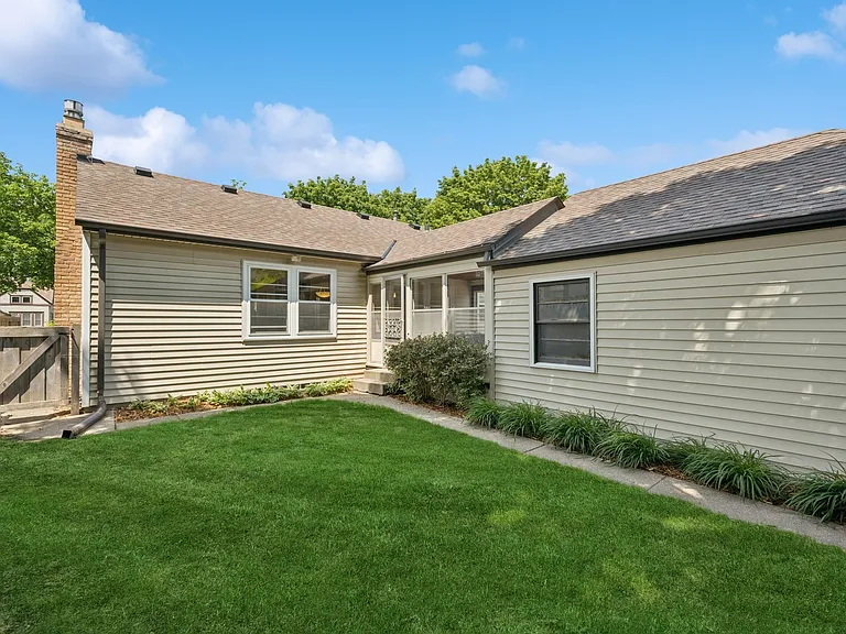 Northern backyard with access to breezeway and to Abbott Ave. through wooden gate
