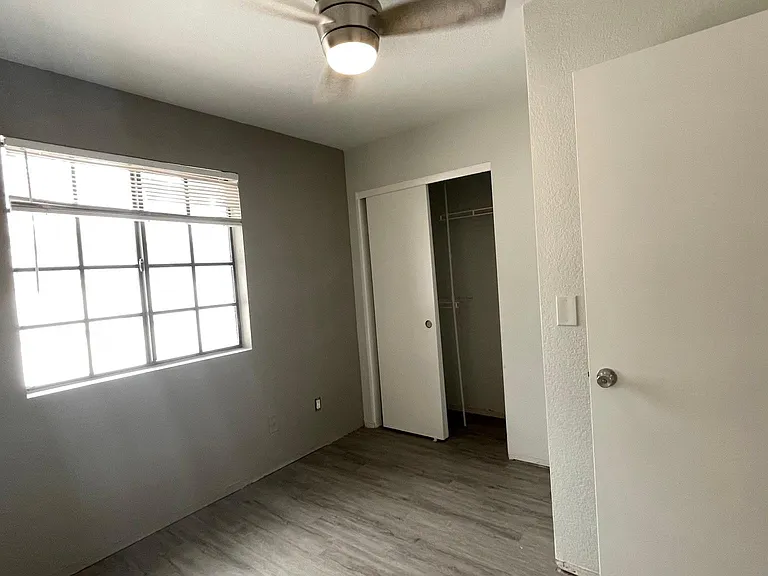Bedroom 2 with sling door closet.