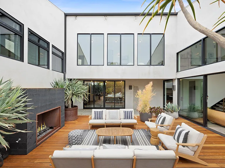 Unwind in the outdoor lounge with fresh air and a crisp fireplace.