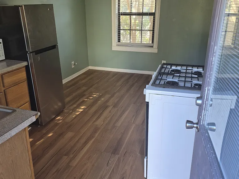 From back door, looking through kitchen into dining area