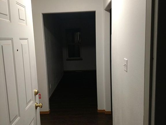 entryway (rooms to left, kitchen to right, living room strai