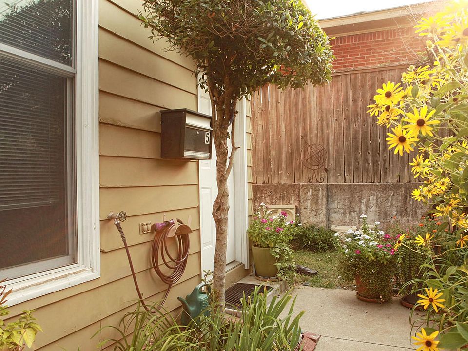 Front entrance, garden view, looking east.