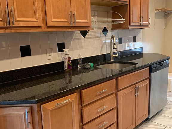 Kitchen with lots of cabinets and dish washer