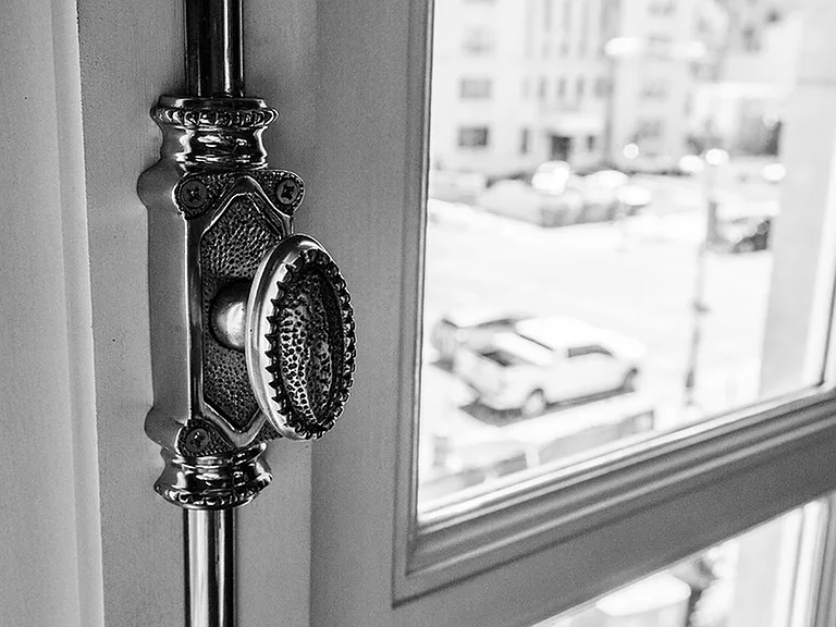 Original features remain throughout the building, including this elegant window knob.
