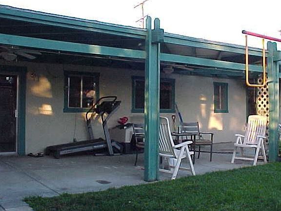 Back of house with covered portch