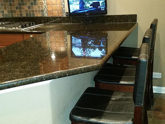 TV and bar chairs not included
