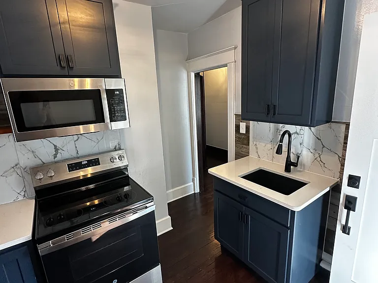Brand new kitchen - custom cabinets w. lazy Susan, stainless appliances, quartz countertops, granite sink