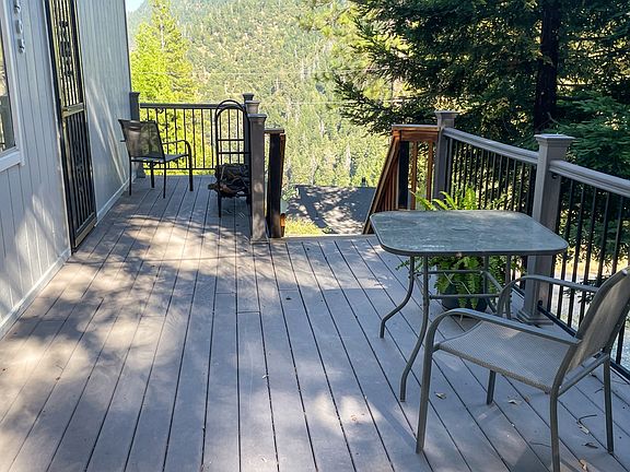 Deck wraps around house from front to back
