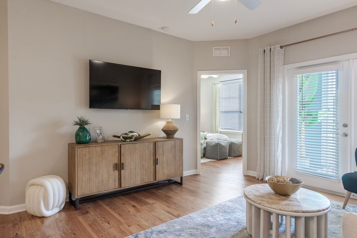 Newly Renovated Living Room with Sleek Hardwood Style Flooring