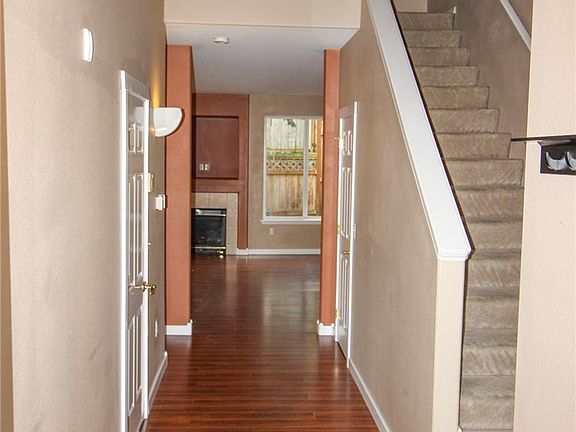 Enter to a 2 story entry with half bath on the right - before stairwell.