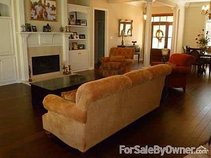 Den
						:
						Real hardwood floors, 12 foot ceilings, fireplace in den