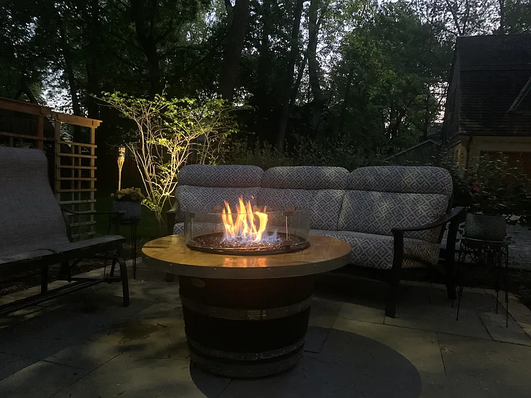 a Gas Fire Pit is positioned on the landscaped Patio at the rear of the home
