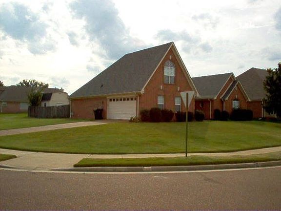 View from the front corner showing garage..