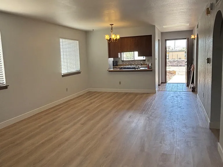 Living room looking to kitchen and front entrance