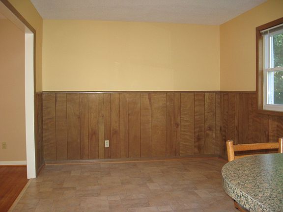 Dining room open to kitchen with breakfast bar between
