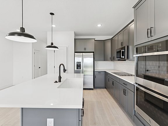 Kitchen with wall oven and stainless steel appliances