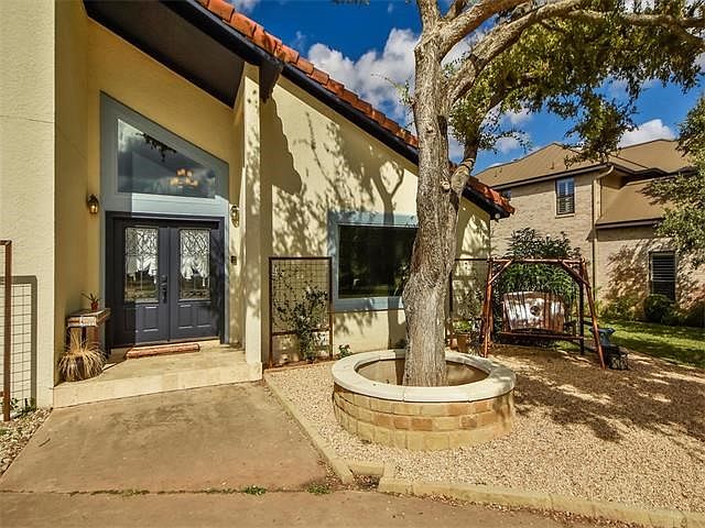 Double front doors make a statement upon arrival.