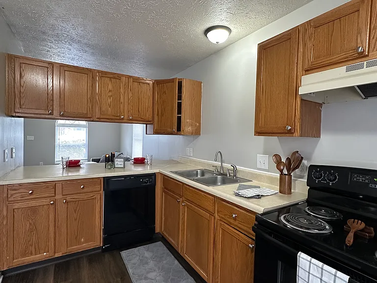 3-Bedroom Kitchen / Dining room - Freshly painted, new plank flooring. Open space to look out into the living room. Great for entertaining