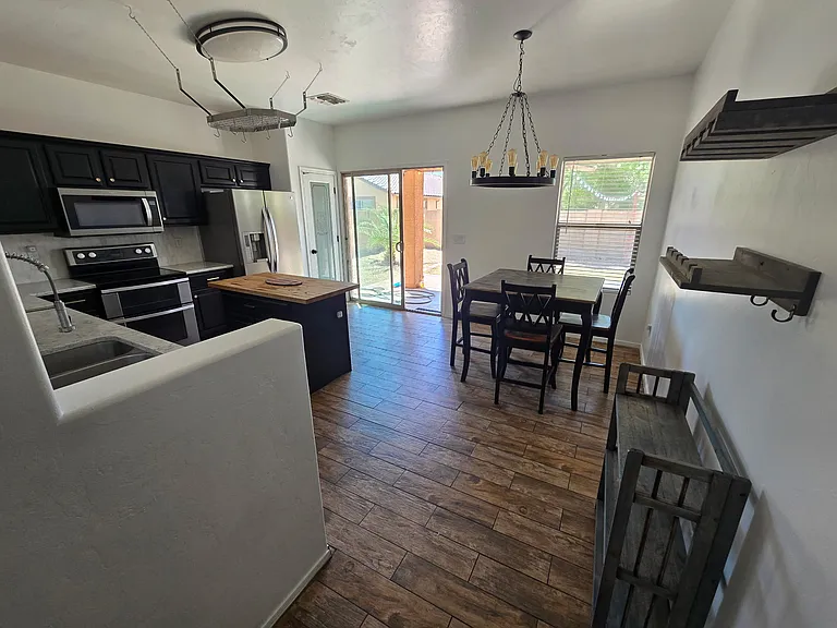View of kitchen from hallway, dining table not included