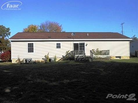 Rear view of home and private deck.