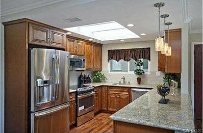 Designer kitchen with stainless appliances, granite counters and