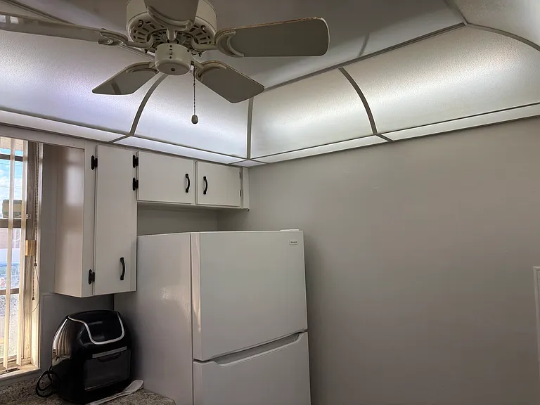 Kitchen dome ceiling with fan.