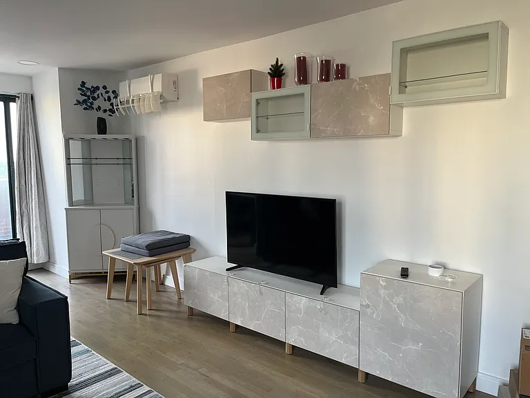 TV station and bar cabinet in the corner