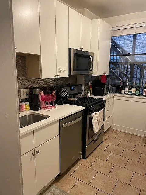 RENOVATED KITCHEN WITH STAINLESS STEEL APPLIANCES
