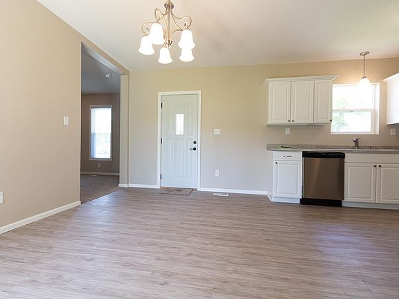 Open Kitchen w/ Dining Area. Front Door Entry. Family Room to the left.