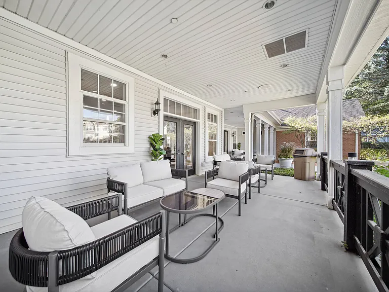 Relax or gather with neighbors in the comfortable covered poolside lounge.