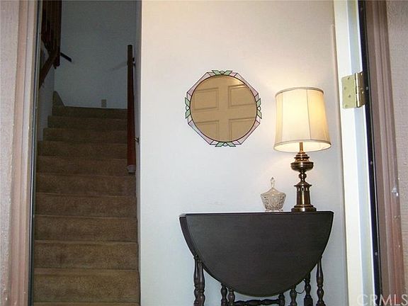Inviting entry, serving stairs, guest suite, coat closet, laundry and garage.
