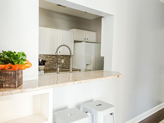 Kitchen pass-through / bar seating over hang