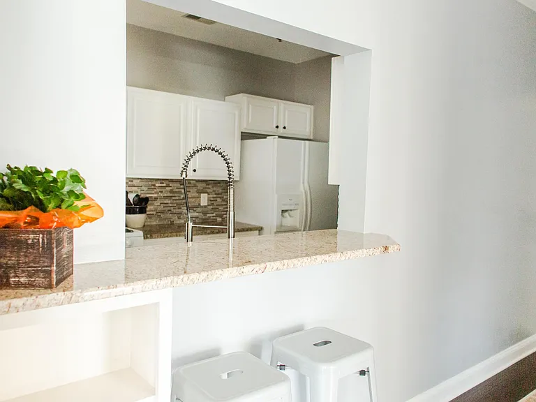 Kitchen pass-through / bar seating over hang