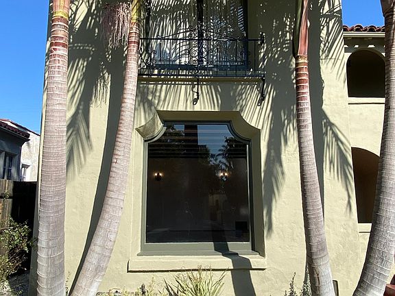 Drought-tolerant landscaping in front of Picture window