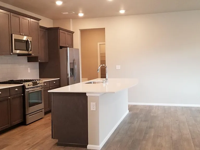 Brand new appliances, subway tiled backsplash, quartz countertop.