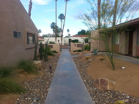 View to street from pool area, unit front door is on the right