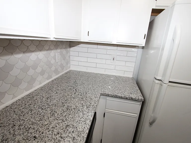 Recently upgraded Granite Countertop with tile backsplash.
